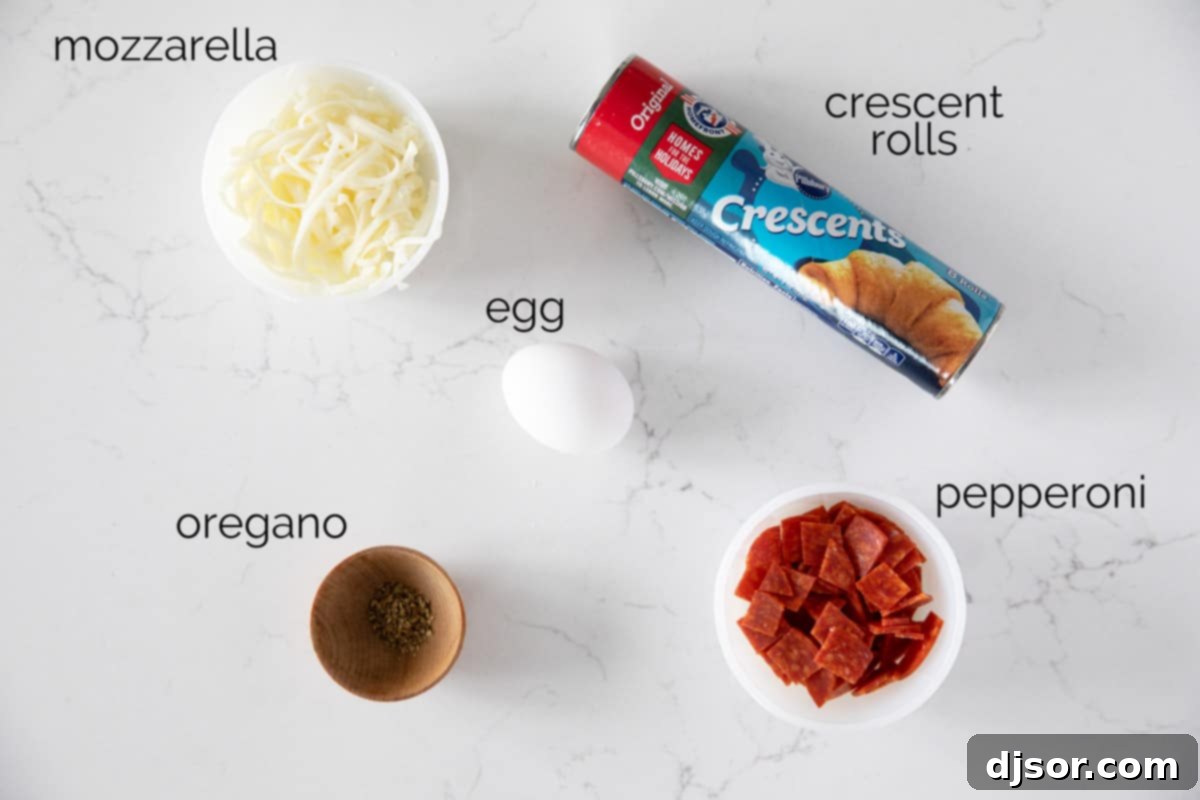 Cheesy Pepperoni Swirls 3 Ingredients for Pepperoni Pinwheels laid out on a cutting board: pepperoni, shredded mozzarella, dried oregano, an egg, and a tube of crescent rolls.