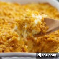 scoop of funeral potatoes in a casserole dish