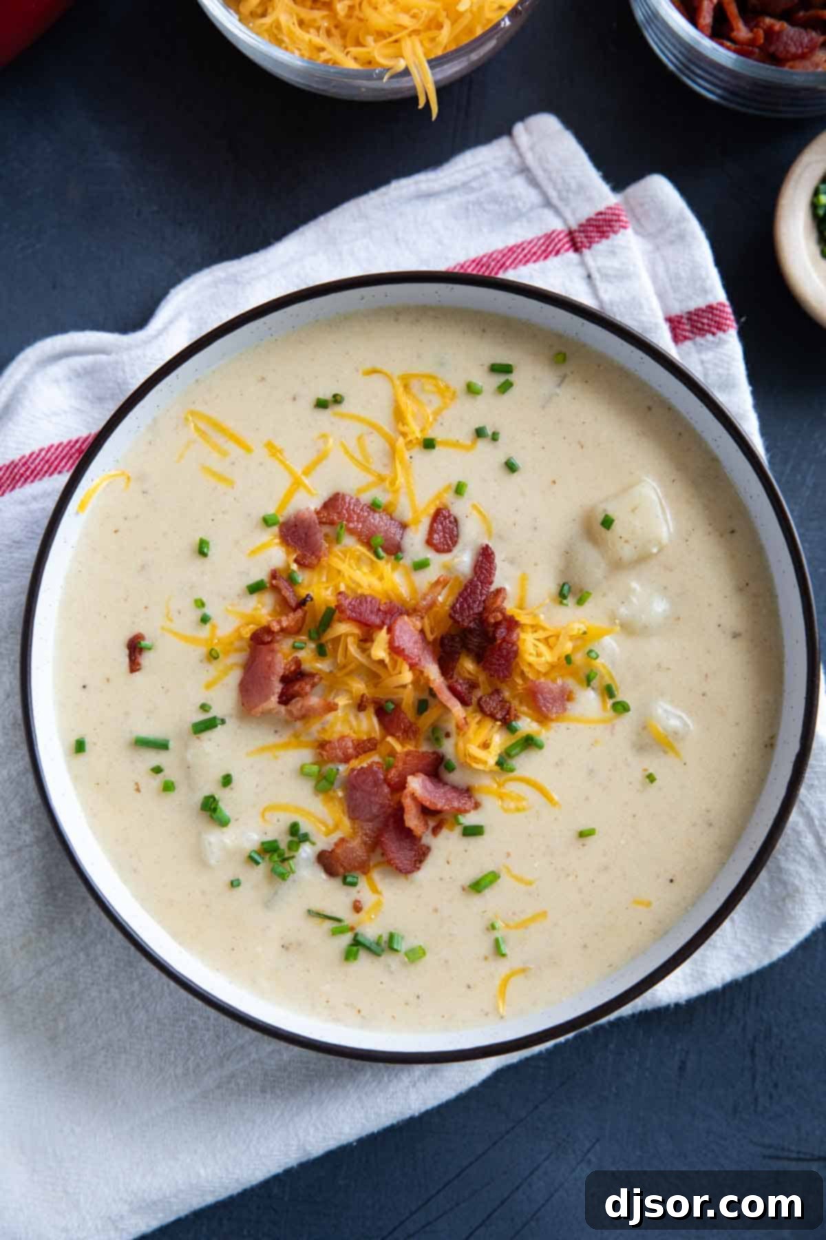 Loaded Baked Potato Soup 8 Bowl of Baked Potato Soup, topped with bacon, cheese, and chives.