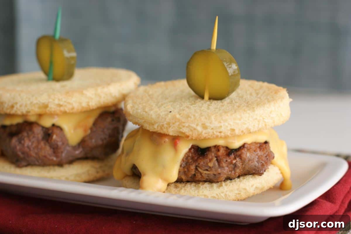 Two Pimiento Cheese Sliders on a plate, ready to be enjoyed as a perfect party snack or meal