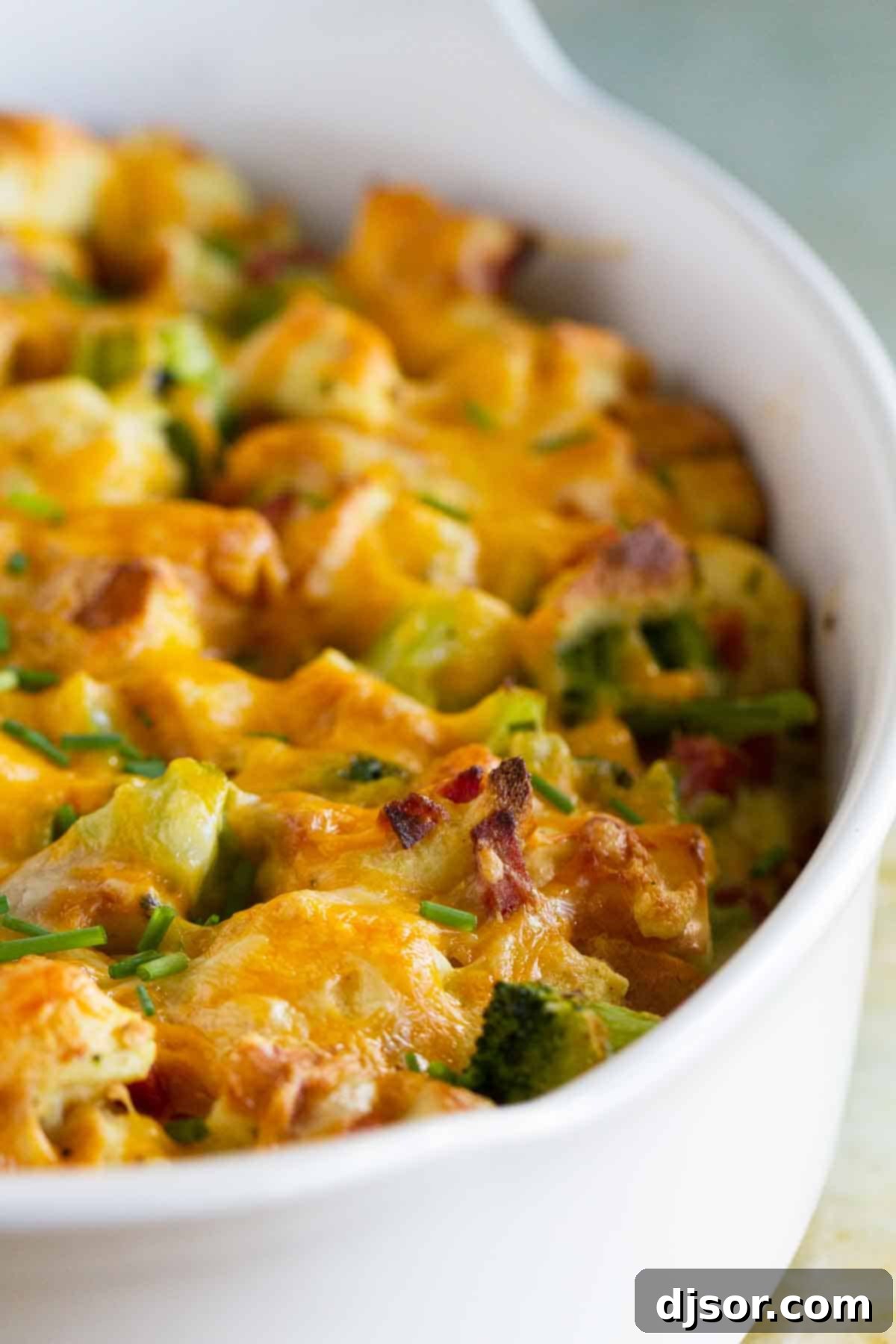 Hearty Ham, Cheese, and Broccoli Bake 3 A large casserole dish brimming with baked Ham and Cheese Strata with Broccoli, fresh from the oven.