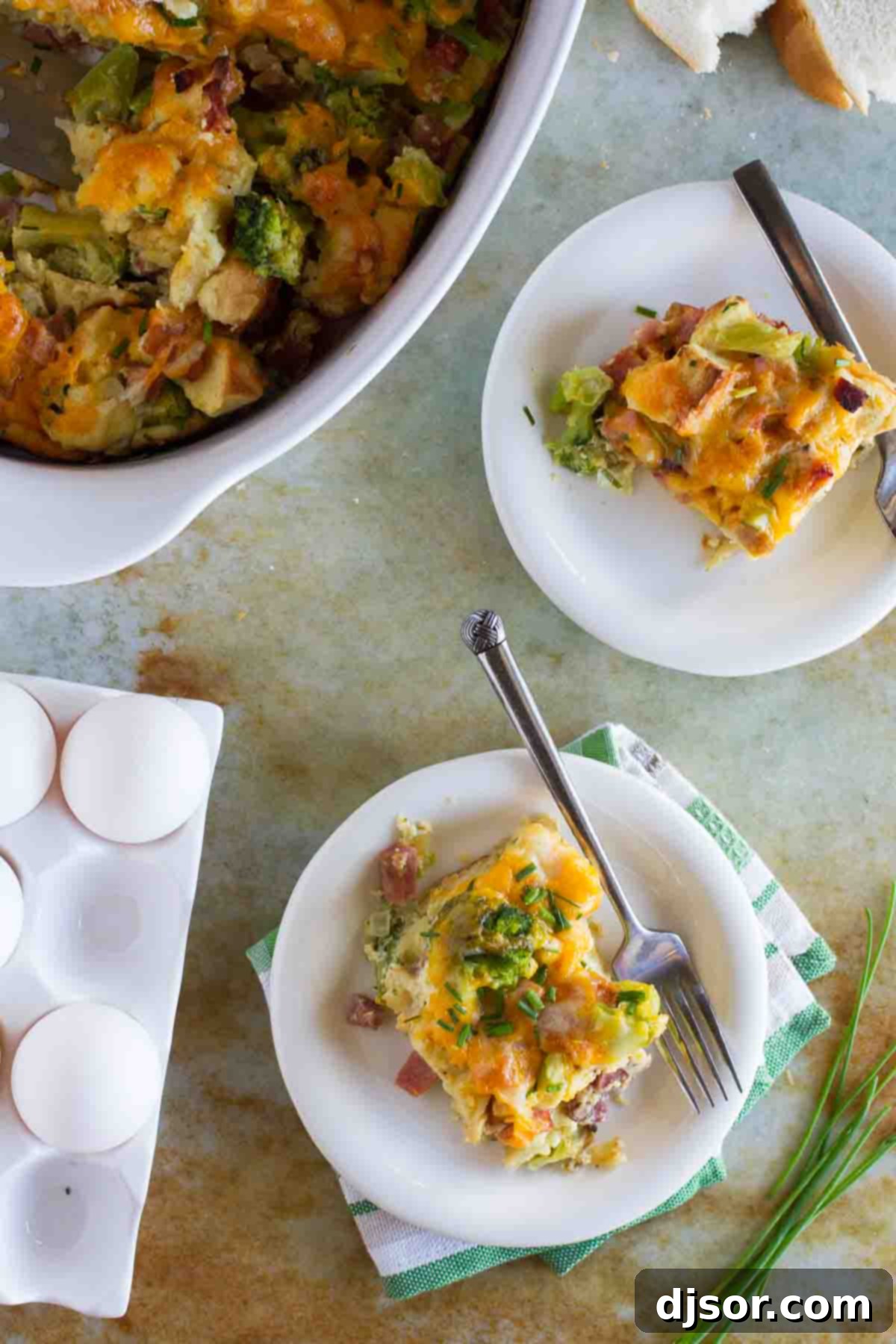 Hearty Ham, Cheese, and Broccoli Bake 4 Two individual servings of Ham and Cheese Strata with Broccoli next to the casserole dish, showing the cheesy top and layered interior.