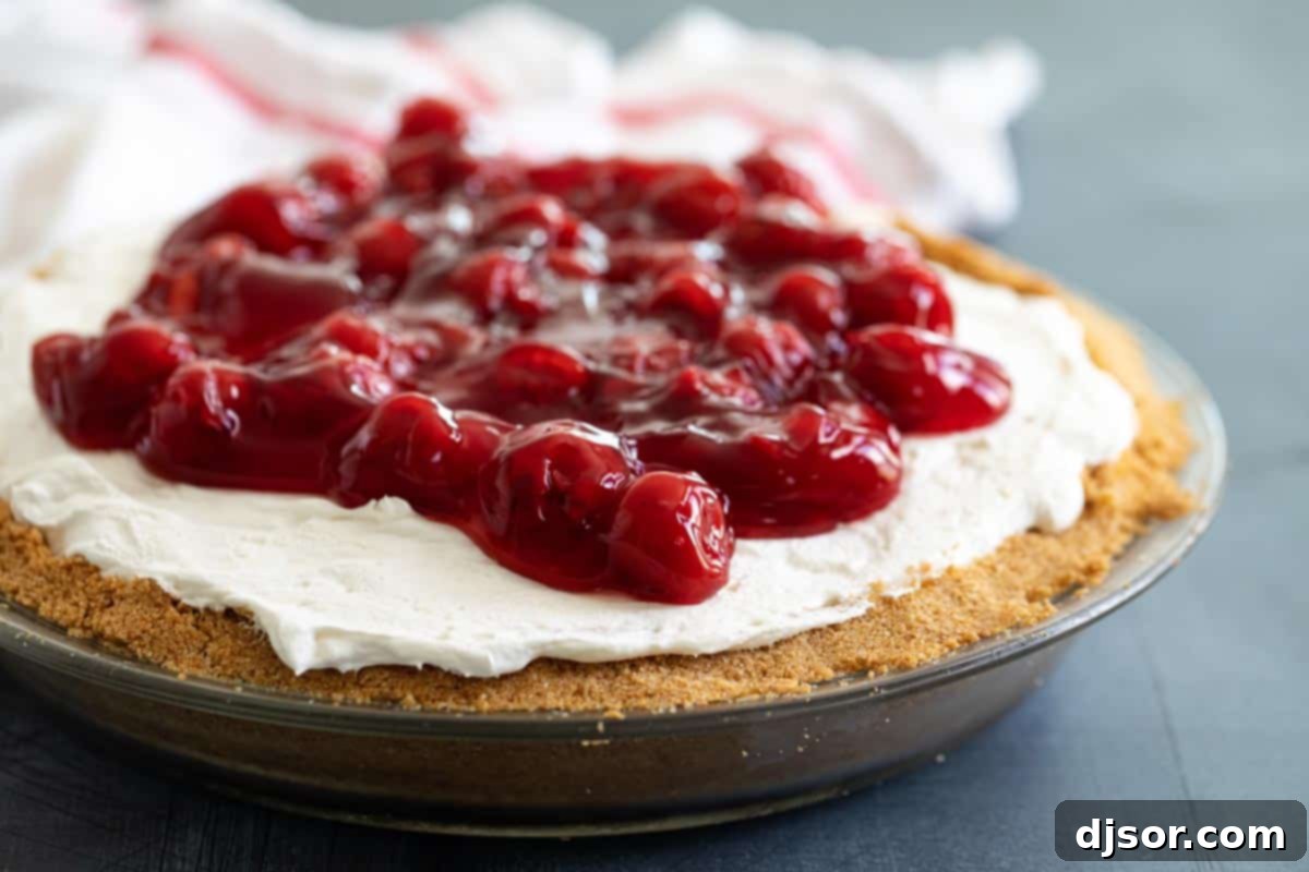 Creamy and smooth, this No Bake Cheesecake is the perfect summer dessert. A sweet cheesecake filling is set inside a graham cracker crust for an irresistible classic dessert. Top it with pie filling to take it up another notch! Cheesecake topped with cherries
