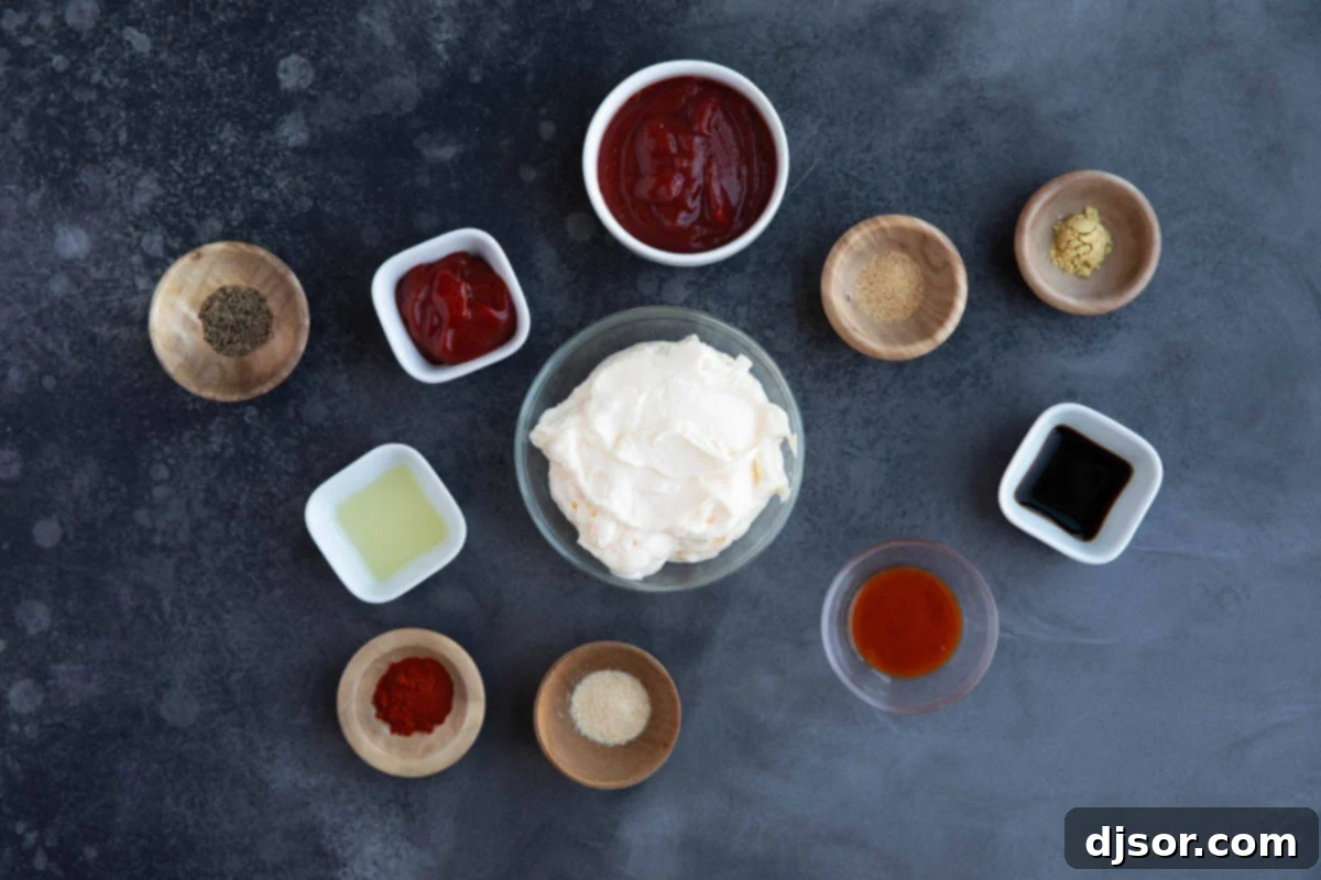 A collection of fresh ingredients laid out on a wooden cutting board, including a jar of mayonnaise, chili sauce, ketchup, lemon, Worcestershire sauce, hot sauce, and various spices, all prepped to make Comeback Sauce.