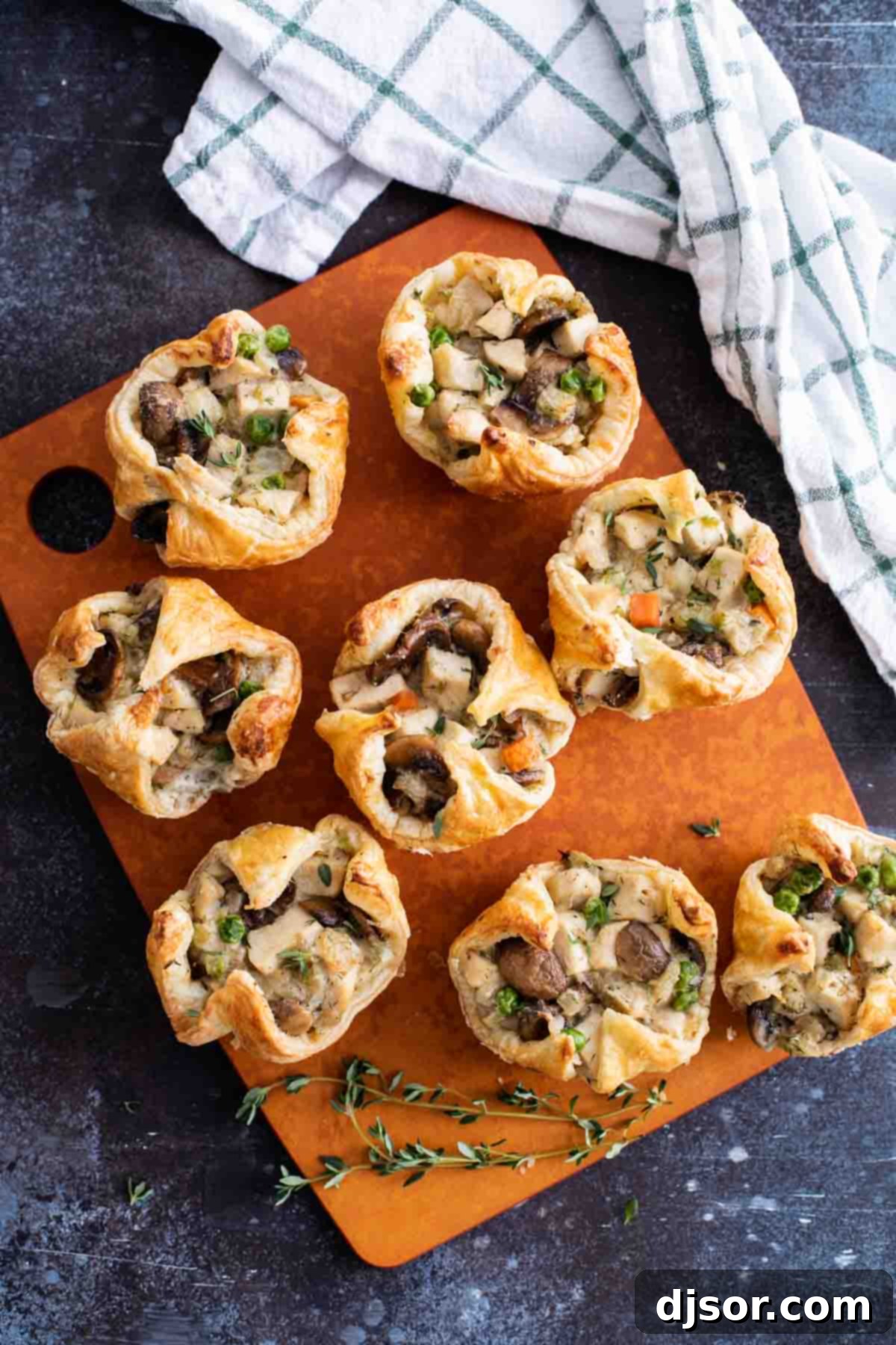 Single Serving Chicken Pot Pies made in a muffin tin, baked to golden perfection.