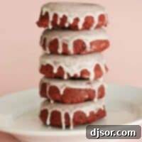 Stack of 5 Baked Red Velvet Donuts, perfectly glazed and ready to be enjoyed