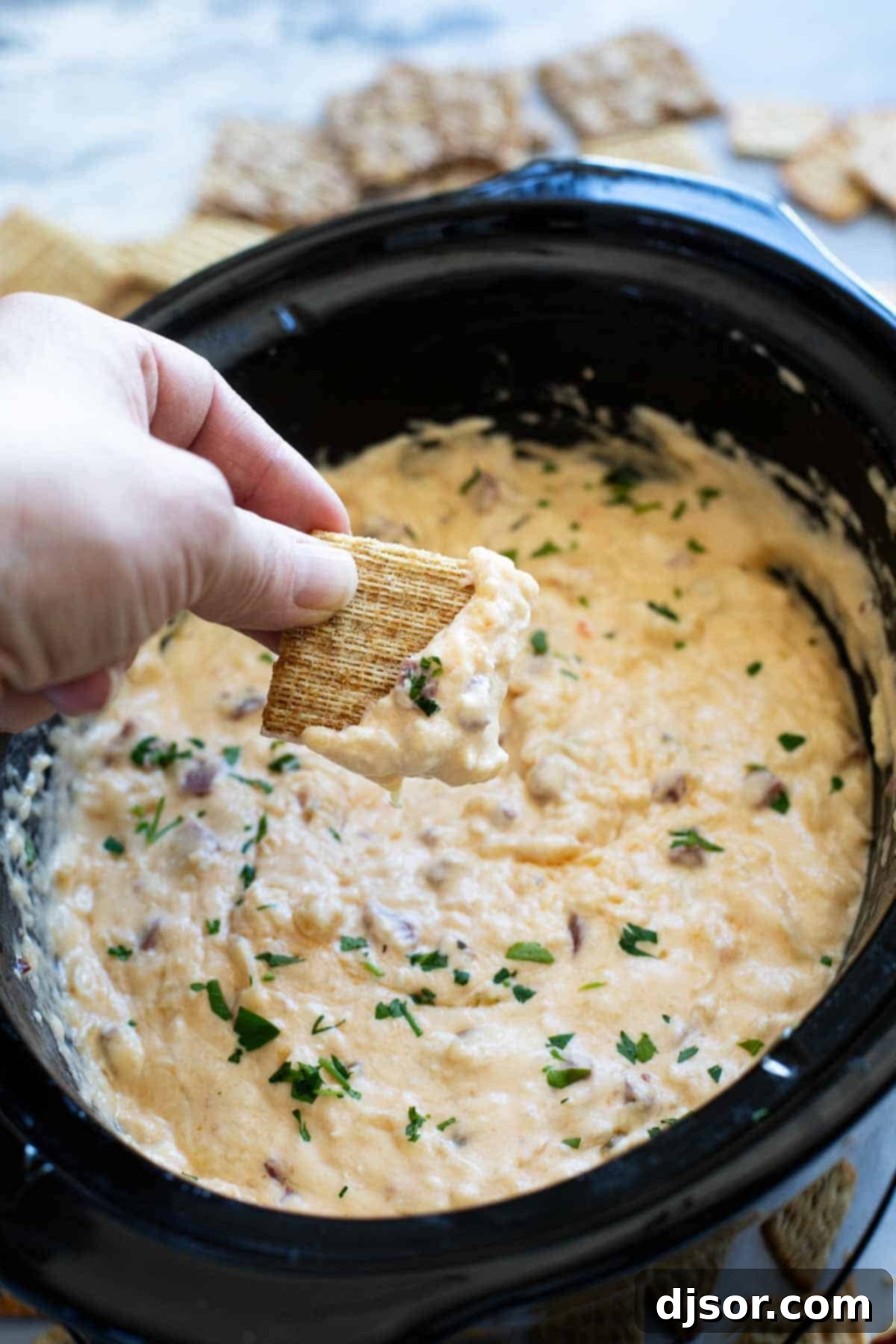 Creamy Slow Cooker Reuben Dip with crackers