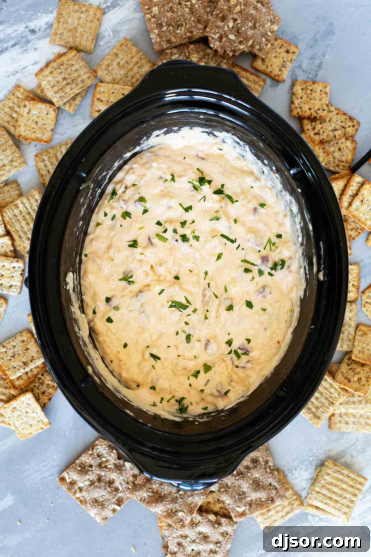 Slow Cooker Reuben Dip served with crackers