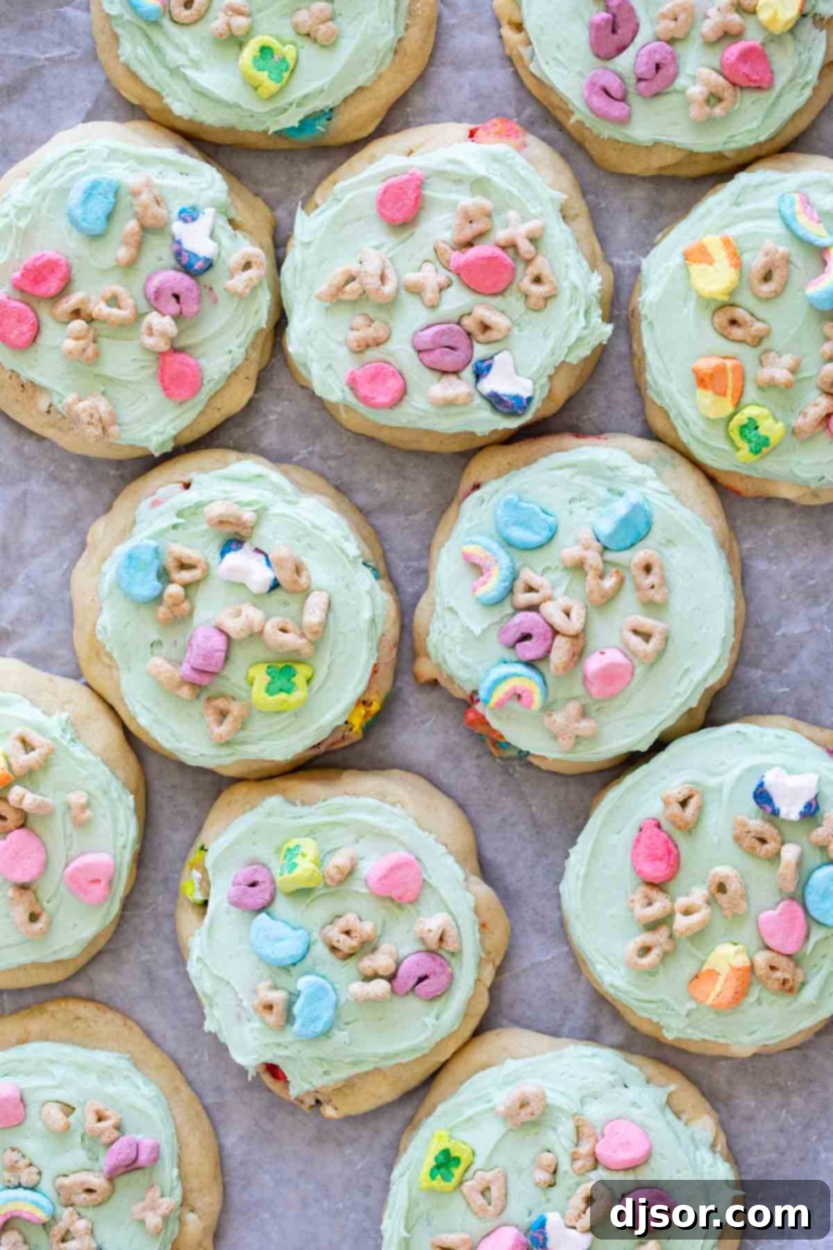 Close-up of Lucky Charms Cookies filled with marshmallows and white chocolate chips and topped with even more Lucky Charms.