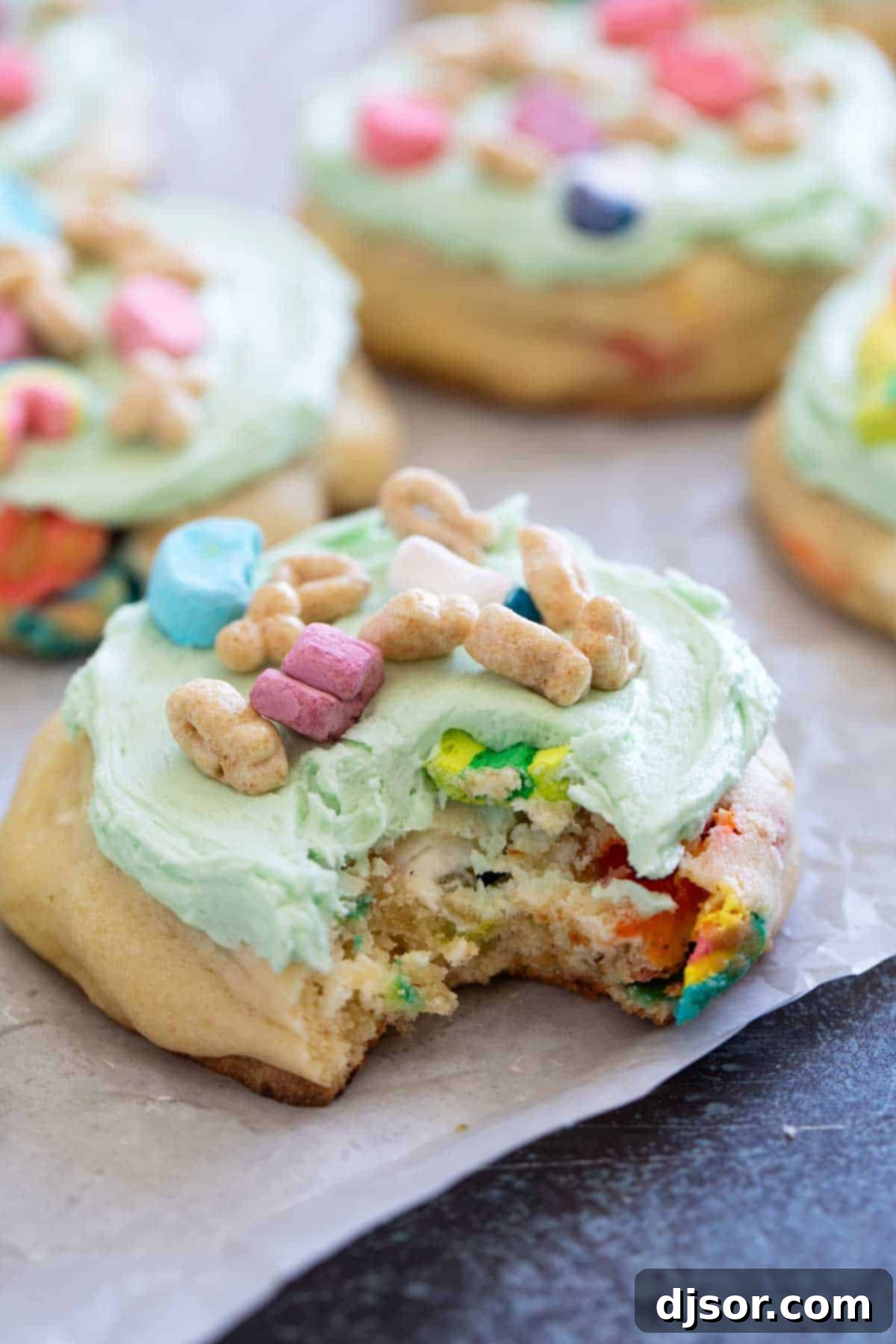 A delicious Lucky Charms Cookie with a bite taken out of it, showing the soft inside.