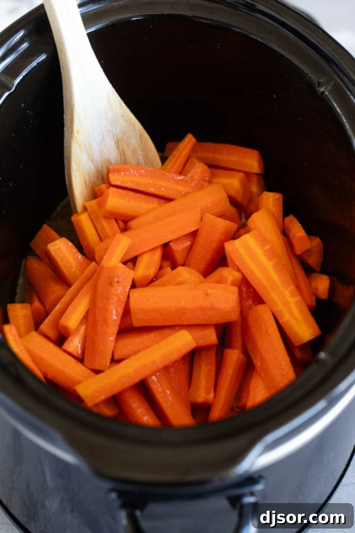 Slow Cooking Carrots Slow cooker carrots cooking in a slow cooker.